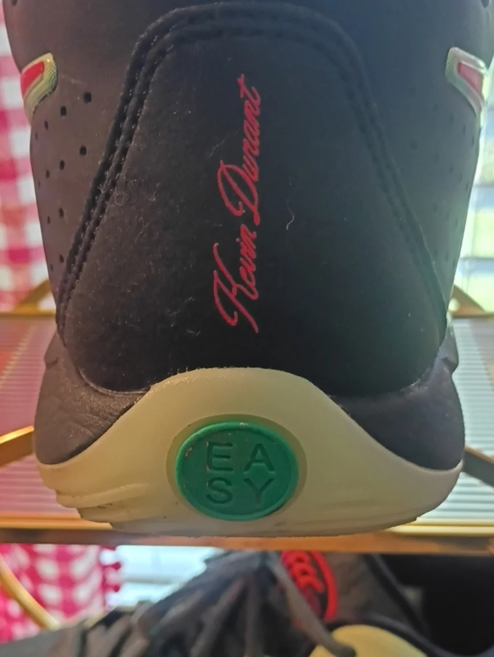 Nike Men’s Black Athletic Shoes with Green and Red Accents